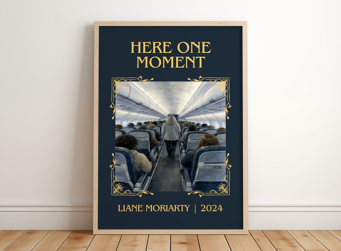 Here One Moment Classic Book Art Print by Liane Moriarty – framed print leaning on a wooden floor