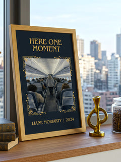 Here One Moment Classic Book Art Print by Liane Moriarty – framed print on a city-view windowsill