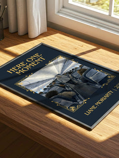 Here One Moment Classic Book Art Print by Liane Moriarty – print on a sunlit desk