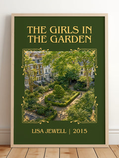 The Girls In The Garden Classic Book Art Print by Lisa Jewell – framed print leaning on a wooden floor