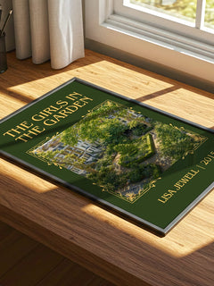The Girls In The Garden Classic Book Art Print by Lisa Jewell – print on a sunlit desk