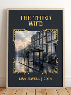 The Third Wife Classic Book Art Print by Lisa Jewell – framed print leaning on a wooden floor