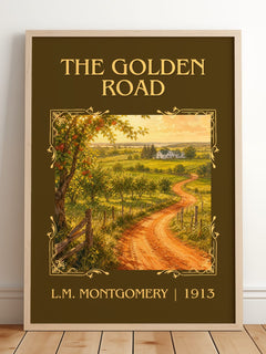 The Golden Road Classic Book Art Print by L.M. Montgomery – framed print leaning on a wooden floor