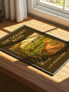 The Golden Road Classic Book Art Print by L.M. Montgomery – print on a sunlit desk