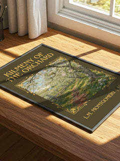Kilmeny Of The Orchard Classic Book Art Print by L.M. Montgomery – print on a sunlit desk