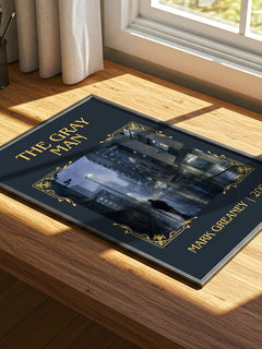 The Gray Man Classic Book Art Print by Mark Greaney – print on a sunlit desk
