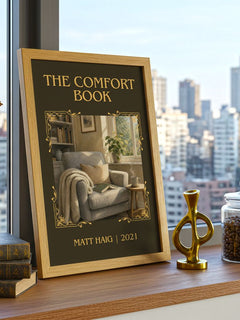 The Comfort Book Classic Book Art Print by Matt Haig – framed print on a city-view windowsill