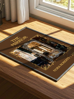 The Mirror Classic Book Art Print by Nora Roberts – print on a sunlit desk