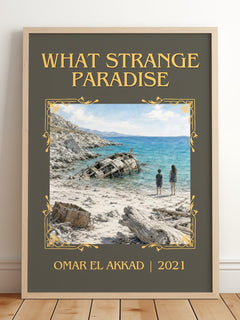 What Strange Paradise Classic Book Art Print by Omar El Akkad – framed print leaning on a wooden floor