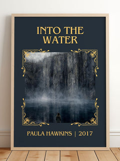 Into The Water Classic Book Art Print by Paula Hawkins – framed print leaning on a wooden floor