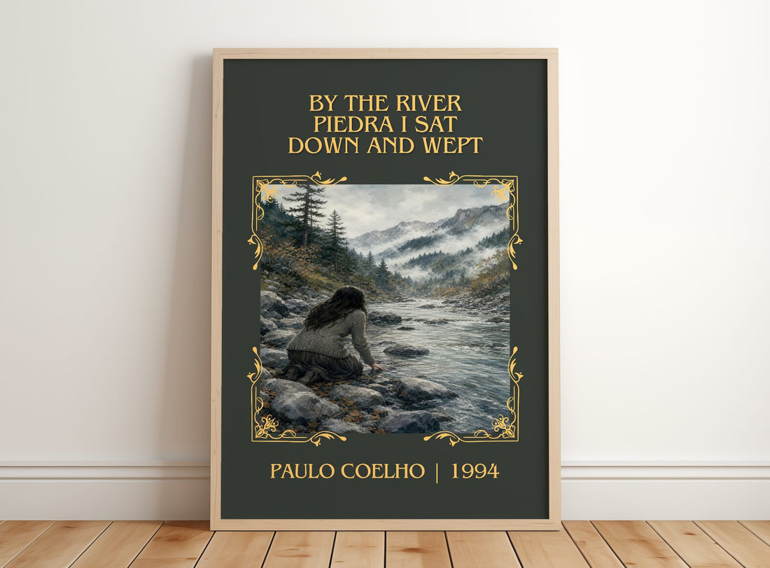 By The River Piedra I Sat Down And Wept Classic Book Art Print by Paulo Coelho – framed print leaning on a wooden floor