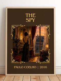 The Spy Classic Book Art Print by Paulo Coelho – framed print leaning on a wooden floor