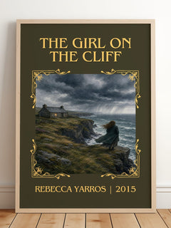 The Girl On The Cliff Classic Book Art Print by Rebecca Yarros – framed print leaning on a wooden floor