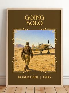 Going Solo Classic Book Art Print by Roald Dahl – framed print leaning on a wooden floor