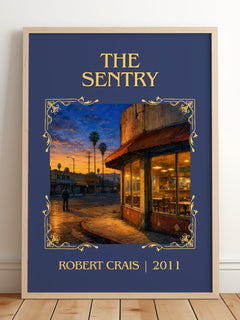 The Sentry Classic Book Art Print by Robert Crais – framed print leaning on a wooden floor