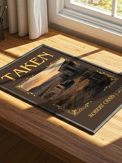 Taken Classic Book Art Print by Robert Crais – print on a sunlit desk