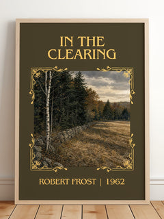 In The Clearing Classic Book Art Print by Robert Frost – framed print leaning on a wooden floor