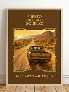 Puerto Vallarta Squeeze Classic Book Art Print by Robert James Waller – framed print leaning on a wooden floor