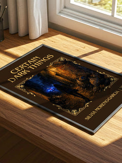 Certain Dark Things Classic Book Art Print by Silvia Moreno-Garcia – print on a sunlit desk