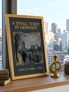 A Small Town in Germany Classic Book Art Print by John le Carré – framed print on a city-view windowsill
