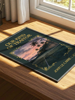Our Kind of Traitor Classic Book Art Print by John le Carré – print on a sunlit desk