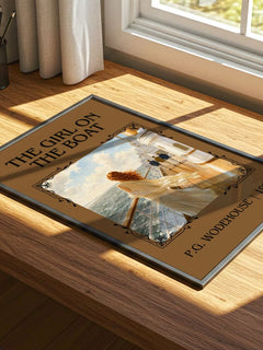The Girl on the Boat Classic Book Art Print by P.G. Wodehouse – print on a sunlit desk