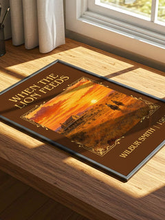 When the Lion Feeds Classic Book Art Print by Wilbur Smith – print on a sunlit desk