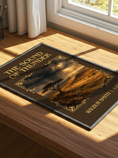 The Sound of Thunder Classic Book Art Print by Wilbur Smith – print on a sunlit desk