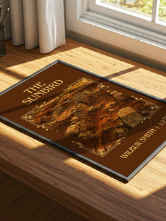 The Sunbird Classic Book Art Print by Wilbur Smith – print on a sunlit desk