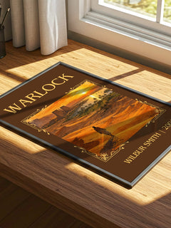 Warlock Classic Book Art Print by Wilbur Smith – print on a sunlit desk