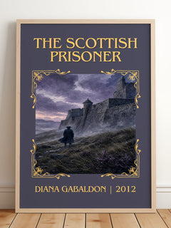 The Scottish Prisoner Classic Book Art Print by Diana Gabaldon – framed print leaning on a wooden floor