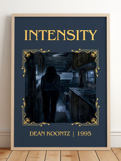 Intensity Classic Book Art Print by Dean Koontz – framed print leaning on a wooden floor