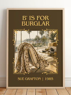 B' Is for Burglar Classic Book Art Print by Sue Grafton – framed print leaning on a wooden floor