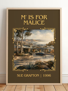M' Is for Malice Classic Book Art Print by Sue Grafton – framed print leaning on a wooden floor