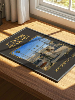 R' Is for Ricochet Classic Book Art Print by Sue Grafton – print on a sunlit desk