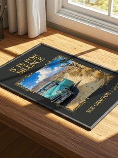 S' Is for Silence Classic Book Art Print by Sue Grafton – print on a sunlit desk