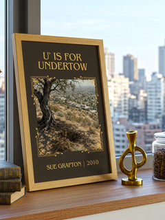 U' Is for Undertow Classic Book Art Print by Sue Grafton – framed print on a city-view windowsill