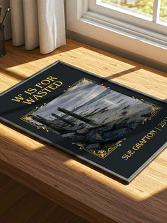 W' Is for Wasted Classic Book Art Print by Sue Grafton – print on a sunlit desk