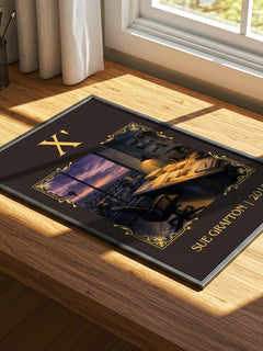 X' Classic Book Art Print by Sue Grafton – print on a sunlit desk