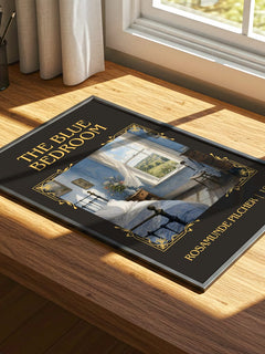 The Blue Bedroom Classic Book Art Print by Rosamunde Pilcher – print on a sunlit desk
