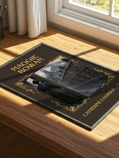 Maggie Rowan Classic Book Art Print by Catherine Cookson – print on a sunlit desk