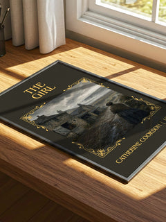 The Girl Classic Book Art Print by Catherine Cookson – print on a sunlit desk