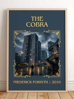 The Cobra Classic Book Art Print by Frederick Forsyth – framed print leaning on a wooden floor