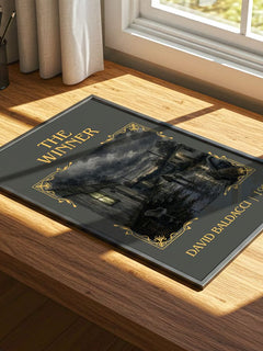 The Winner Classic Book Art Print by David Baldacci – print on a sunlit desk