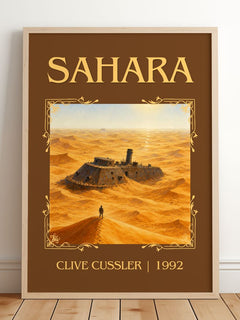 Sahara Classic Book Art Print by Clive Cussler – framed print leaning on a wooden floor
