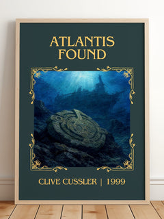 Atlantis Found Classic Book Art Print by Clive Cussler – framed print leaning on a wooden floor