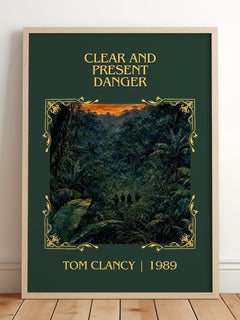 Clear and Present Danger Classic Book Art Print by Tom Clancy – framed print leaning on a wooden floor