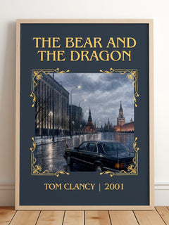 The Bear and the Dragon Classic Book Art Print by Tom Clancy – framed print leaning on a wooden floor