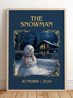 The Snowman Classic Book Art Print by Jo Nesbø – framed print leaning on a wooden floor