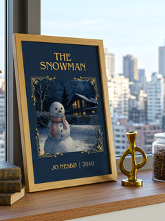 The Snowman Classic Book Art Print by Jo Nesbø – framed print on a city-view windowsill